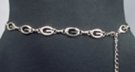 silver chain belt made of 29 inches of 5/8" wide flecked oval G's and 14 inches of chain with singleton G at tip