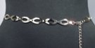 silver chain belt made of 29 inches of 5/8"-wide ovals and 14 inches of chain with heart-shaped pendant