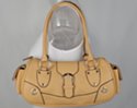 tan baguette handbag with zipper top and double shoulder straps