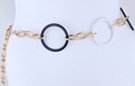 chain belt, black and white big circles alternating with triple oval gold links; alternating short smooth and long stippled twisted link extension chain with black circle at tip