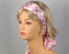 big pink polka dot and white headscarf attached to plastic headband
