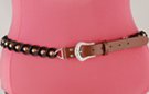 black chain belt; smooth double links inset with faceted gold globes; brown leather tab with silver buckle