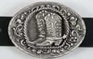 oval pewter western belt buckle with cowboy boots and spurs