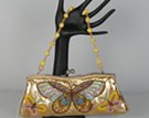 east-west party clutch with embroidered butterflies