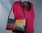 cord strap shoulder purse with flowing contour