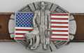 belt buckle, cowboy with saddle and lariat, American flag behind