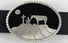 moonlit cowboy kneeling at cross oval belt buckle