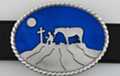 moonlit cowboy kneeling at cross oval belt buckle