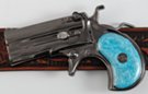 gunmetal derringer pistol belt buckle with blue perl handle