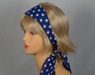 blue headscarf with white polka dots attached to plastic headband