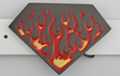 diamond shape belt buckle with red and yellow flames on black