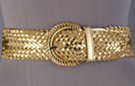 wide faux leather braided glitter belt with circular braided buckle