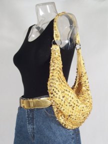gold sequin hobo bag with gold leather belt and jeans