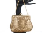 small gold metal mesh handbag with carry chain