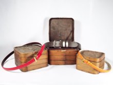 Red, orange and brown leather belts with Chinese rattan boxes