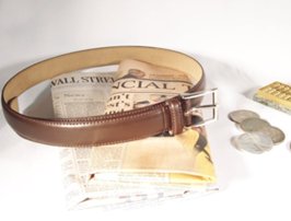 dress belt with abacus, coins and financial newspapers