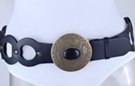 wide black loops with studs, big bronze disk and black stone western-style buckle