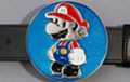 Little man belt buckle, red, blue and black on metallic blue field