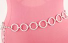 chain belt: bright silver stippled rings joined by textured silver chain links; silver chain links form extension tipped by small ball