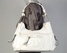 white designer jean frame bag with zippered pockets jean seams