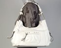 white designer jean frame bag with zippered pockets jean seams