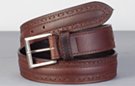 brown oil-tanned full-grain leather belt with ornamental lace along sides, brass buckle and leather keeper