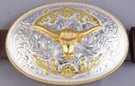 large belt buckle, gold-tone longhorn mounted on chrome oval