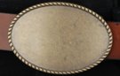 elongated oval antique brass western belt buckle with rope edge