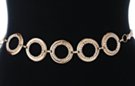 rhinestone rings and gold braided gossamer mesh chain belt