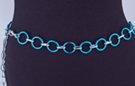 chain belt: smooth blue 1" rings joined by textured silver chain links; extension chain comprises textured oval links tipped by tiny silver ball