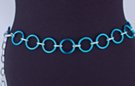 chain belt: smooth blue 1-1/4" rings joined by textured silver chain links; extension chain comprises textured chain links tipped by small silver ball