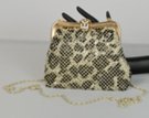 snow leopard white clip-top metal mesh evening bag