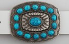 oblong southwest style belt buckle, turquoise ring around nugget