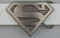 belt buckle, gray "S" and shield on grain field