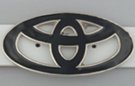 ovals in oval belt buckle looking like Toyota hood mark