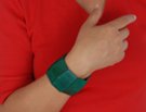 woman in red with green bracelet